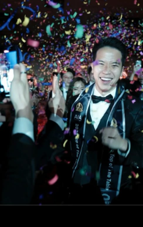 Wilfred Wong smiling at an awards celebration